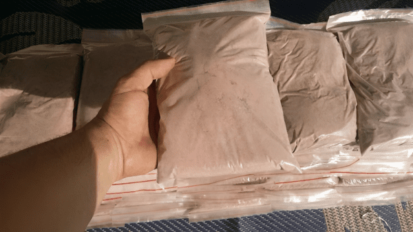 mimosa Hostilis Root Powder inside a plastic ziplocked bag.png